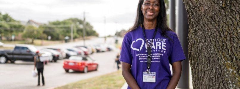 Carlene King, a community health worker at Cancer Care Services, stands outside LVTRise food pantry. (Cristian ArguetaSoto | Fort Worth Report)