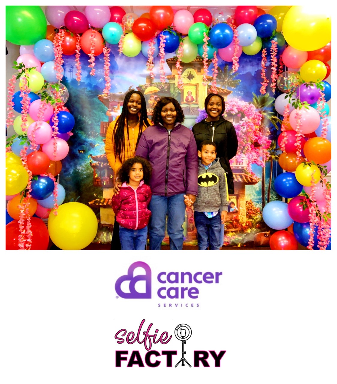 A family takes a photo with the selfie station at the March 2022 Connect Night.