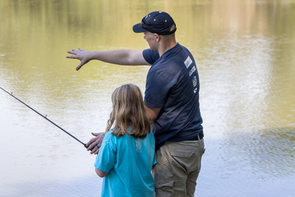 A father and his daughter fish at Reel Connection 2022.