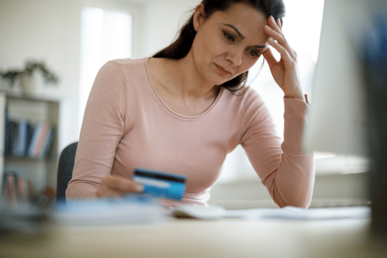 A woman stresses over medical bills of which a financial advocate can help her sort through.