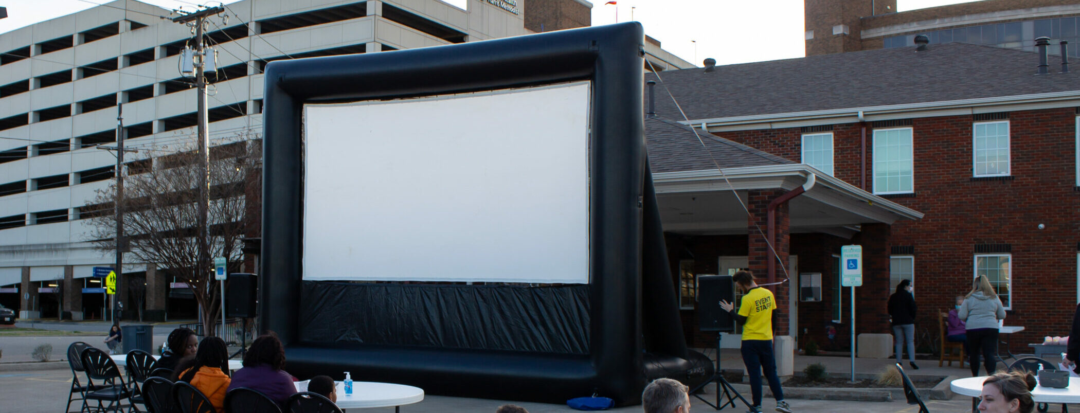 Clients attend an outdoor movie screening for the March Connect Night at Cancer Care Services.