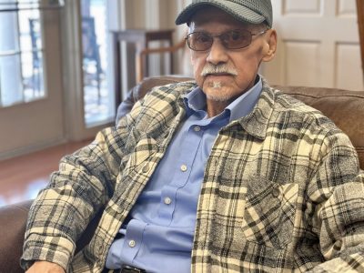 Jessie sits in theliving room at Cancer Care Services as he tells "Jessie's Story of Hope."