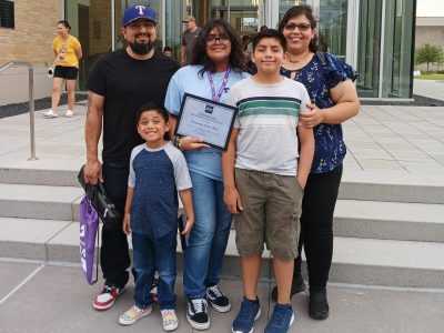 Kayla poses with her family, who she mentions during Kayla's Story of Hope video.